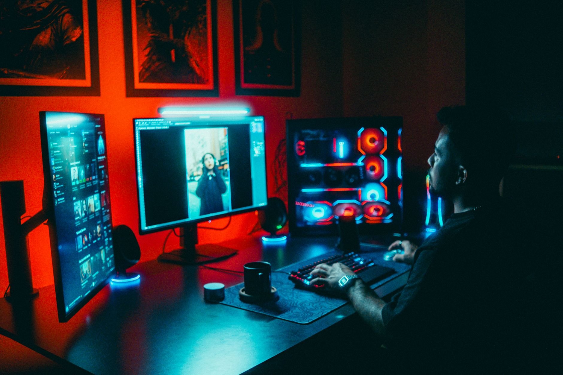 Game developer at a multi-screen computer setup — the kind of late-night sessions that make Champignon Studios games